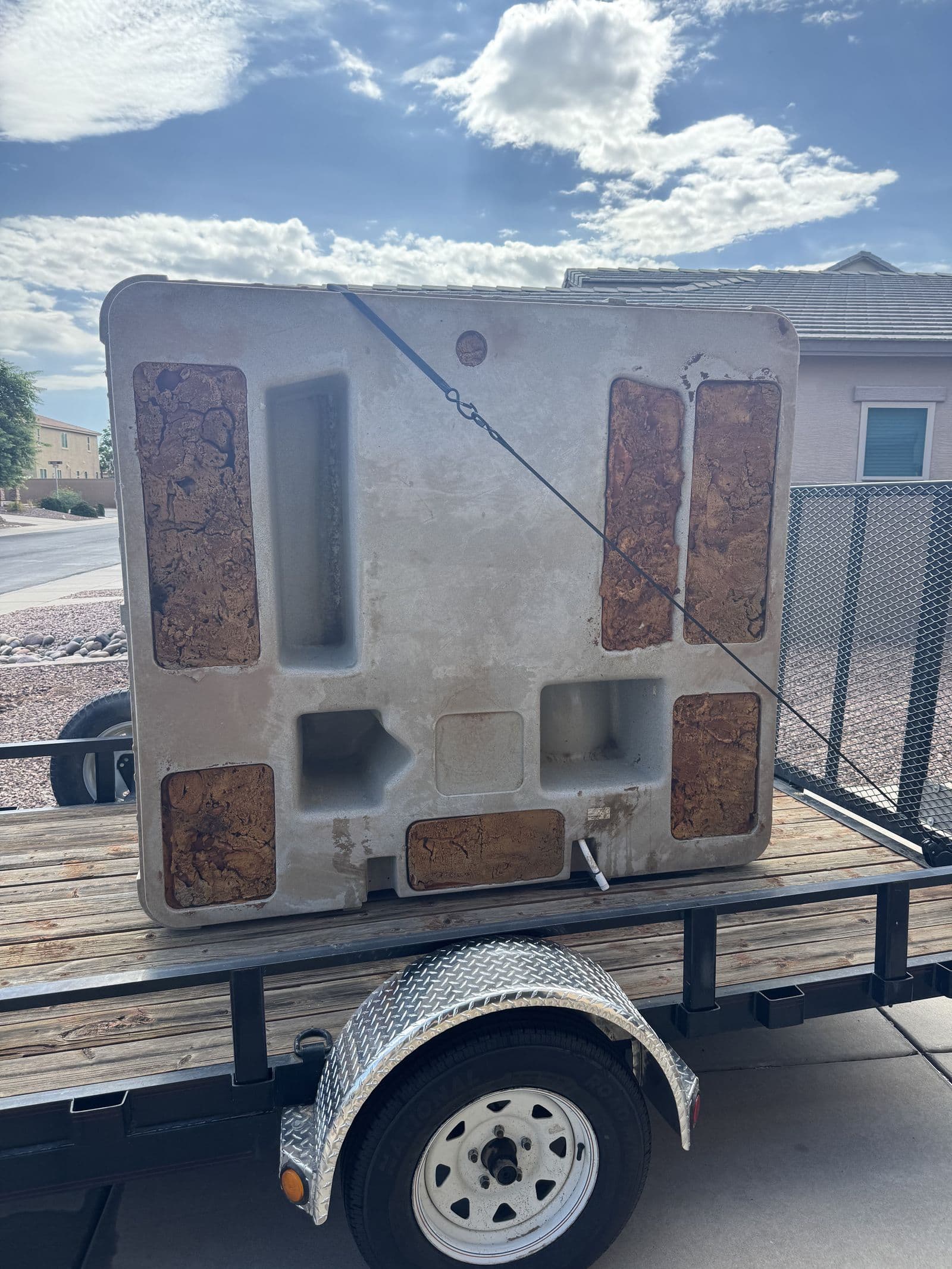 Hot tub strapped down on the Sonoran Standard trailer for haul-away